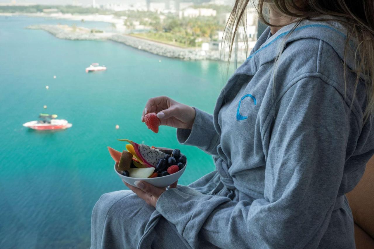 Hyatt Centric Jumeirah Dubai Exterior photo A woman wearing a bathrobe